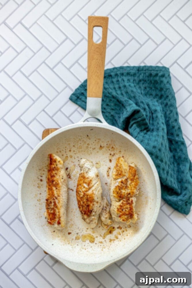 Roasted Turkey Tenderloin and Sweet Potatoes 9 picture of seared turkey tenderloins in a pan