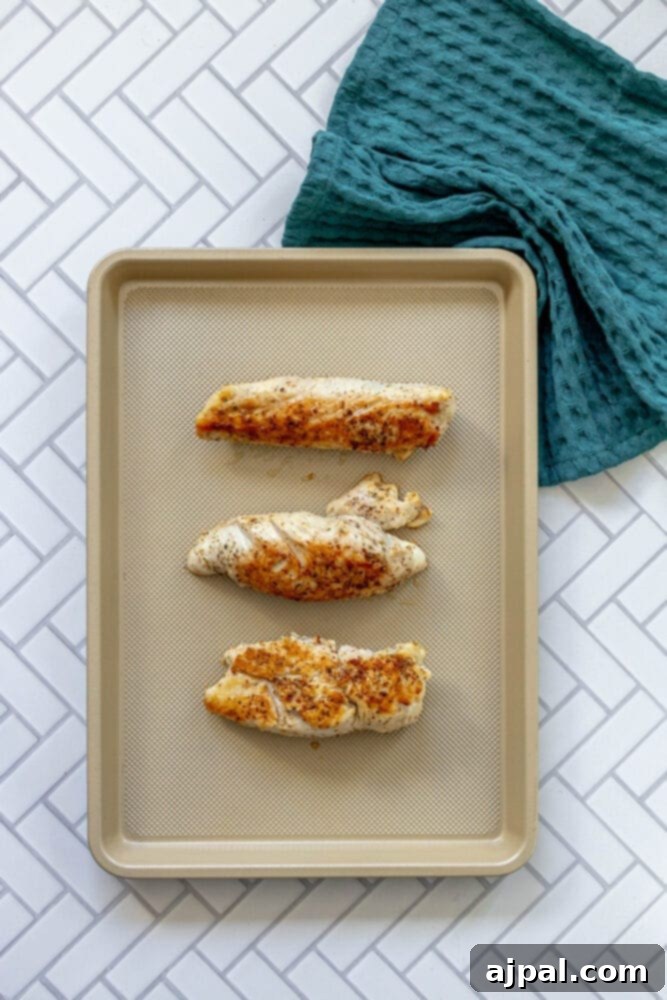 Roasted Turkey Tenderloin and Sweet Potatoes 10 picture of turkey tenderloins on a baking sheet