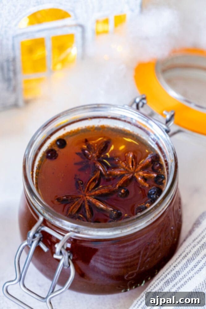 Warming Winter Spice Syrup 4 A jar of honey infused with star anise, creating a spiced simple syrup.