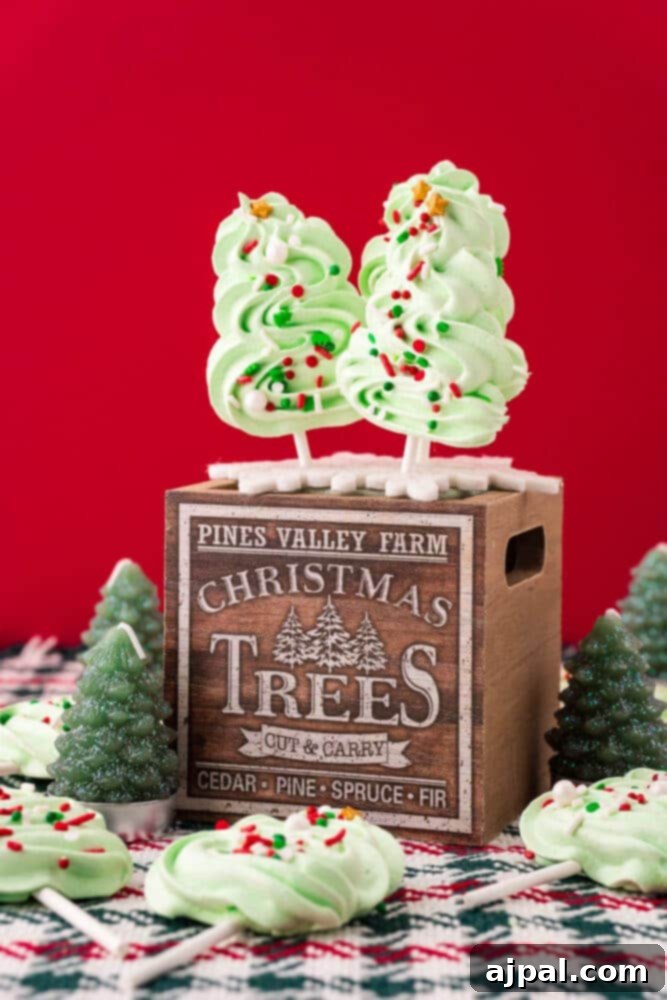 picture of meringue christmas tree cookie pops on a wooden box