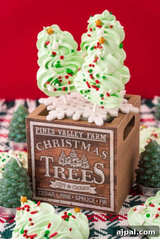 picture of meringue christmas tree cookie pops on a wooden box