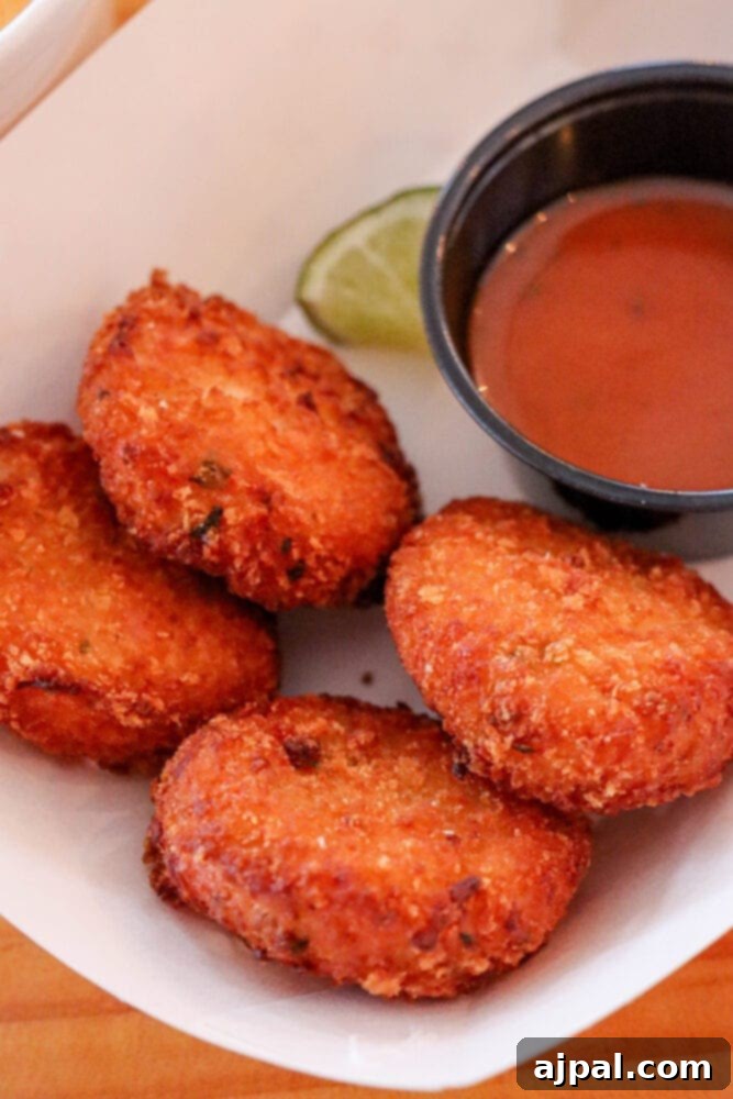 Delectable crab cakes, golden and crispy, served hot at Tracy's King Crab Shack in Juneau, Alaska.