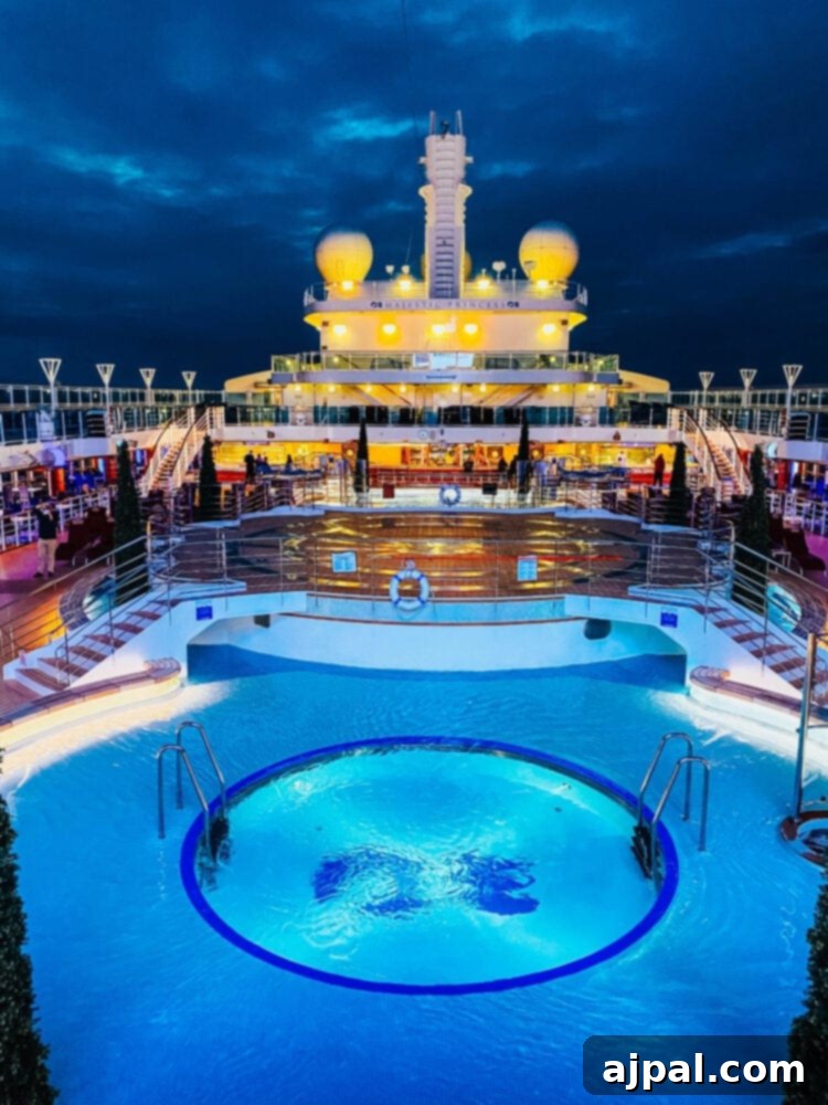 A beautifully lit pool area at night on the Majestic Princess cruise ship, creating a serene and inviting atmosphere after a day of exploration in Juneau, Alaska.