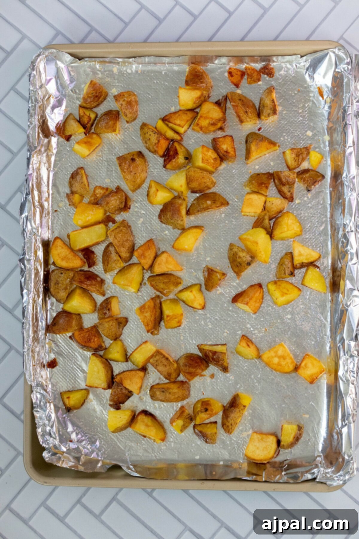 Crispy roasted potatoes baking in the oven.