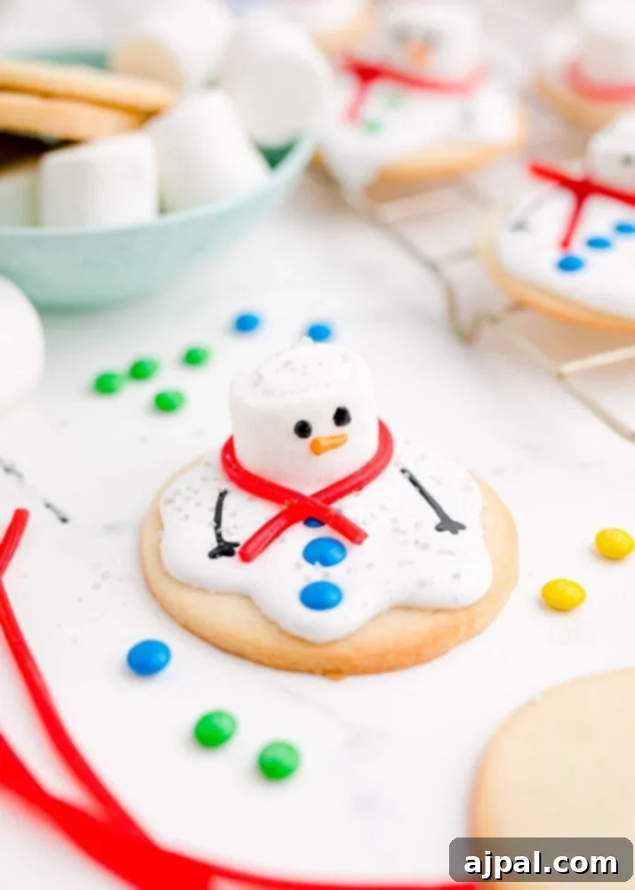 Snowman Meltdown Cookies 2 picture of a melted snowman cookie on a table, adorned with marshmallows and sprinkles, showcasing its charming 'melted' effect