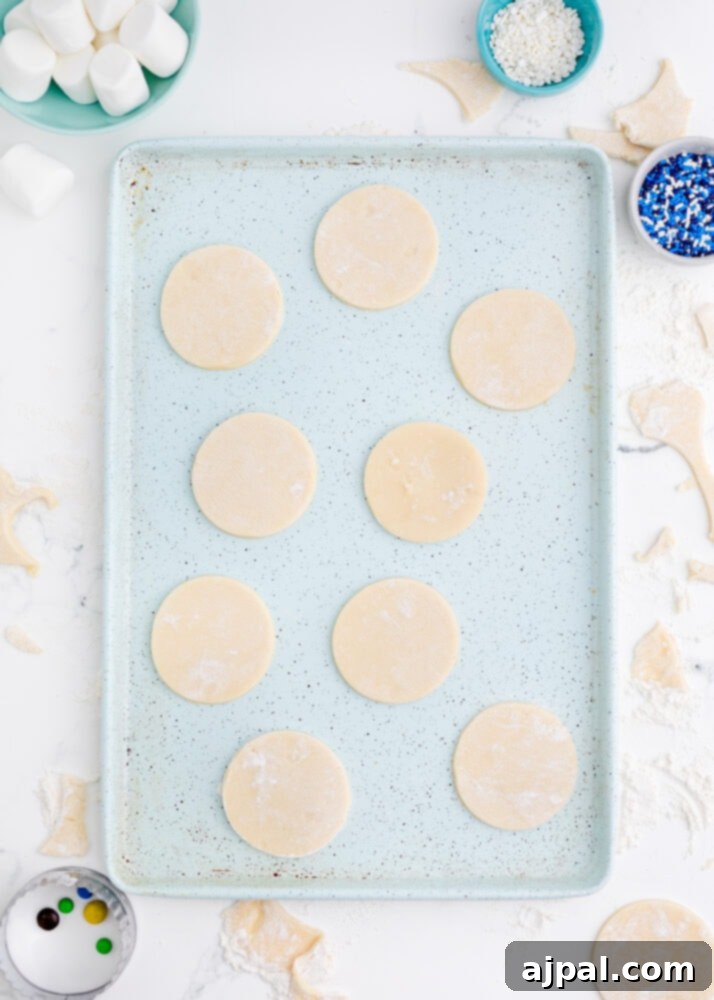 Snowman Meltdown Cookies 11 picture of perfectly arranged cookie dough circles on a baking sheet, ready for the oven
