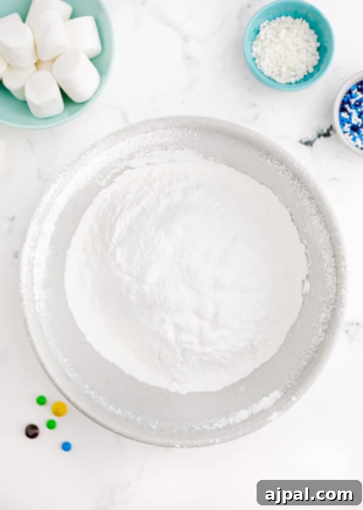 Snowman Meltdown Cookies 13 picture of a bowl of powdered sugar, perfectly sifted and ready for icing preparation