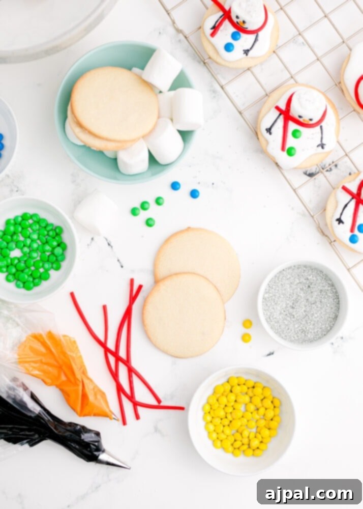 Snowman Meltdown Cookies 17 picture of a cookie on a table with sprinkles around it, ready for the melted snowman icing