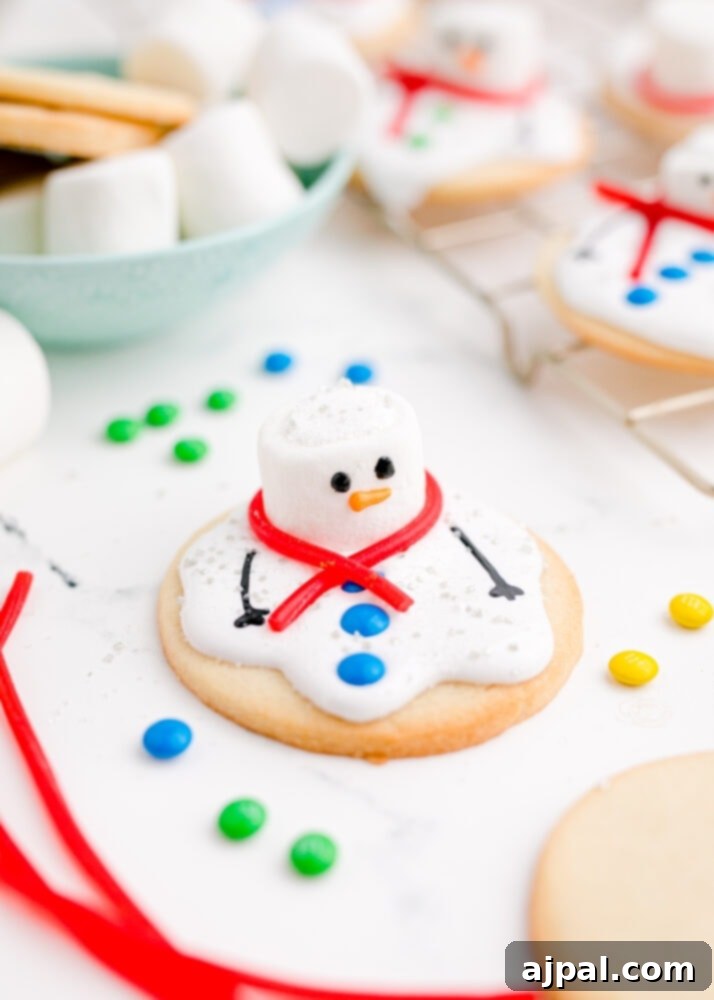 Snowman Meltdown Cookies 25 picture of a fully decorated melted snowman cookie, complete with details and festive candies