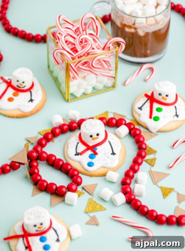 Snowman Meltdown Cookies 4 picture of a melted snowman cookie on a table, with festive candy canes and marshmallows