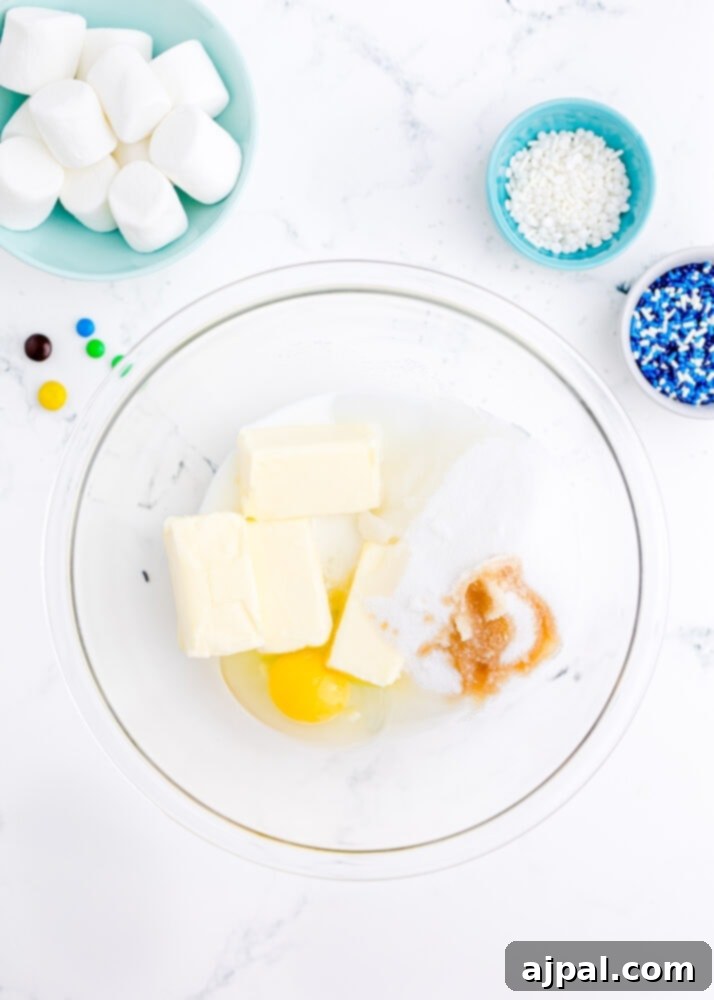Snowman Meltdown Cookies 6 picture of eggs, butter, vanilla, and sugar in a bowl, ready for mixing