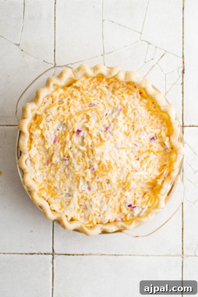 Simple Savory Tomato Pie 15 The creamy, cheesy topping spread evenly over the layers of tomatoes, basil, and bacon in the pie crust, before baking.