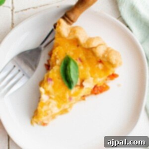 picture of a slice of tomato pie on a plate