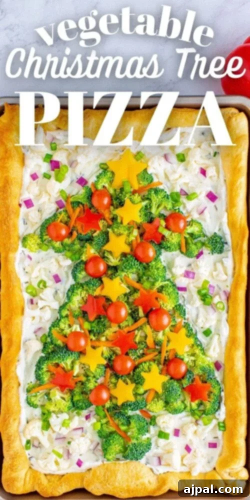 A stunning top-down view of the completed Christmas tree vegetable pizza, vibrant with green broccoli, red tomatoes, and yellow bell pepper stars.