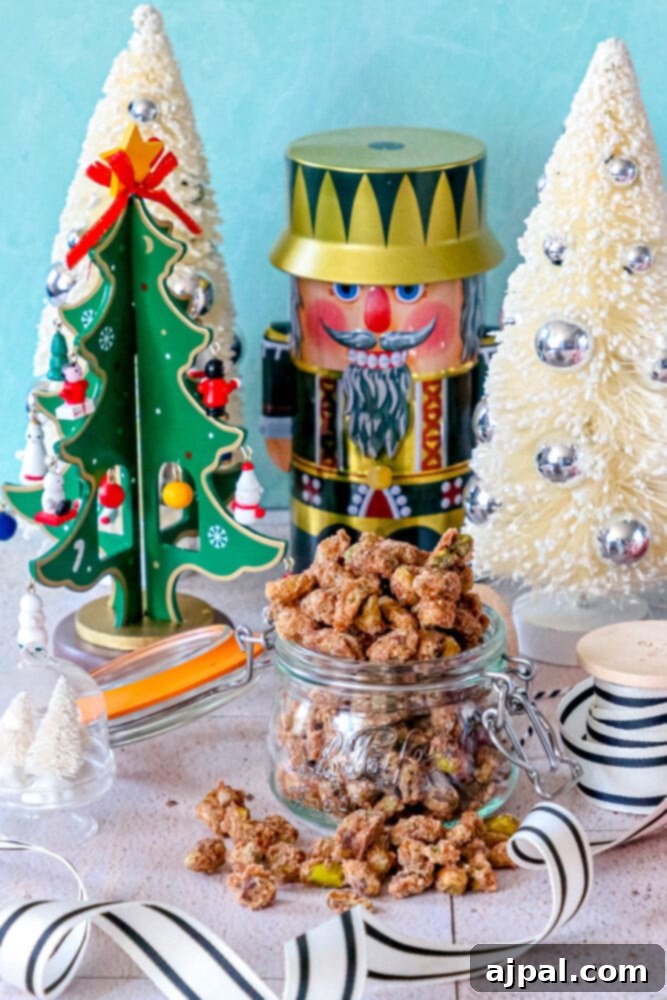 A beautiful array of spiced candied pistachios in a jar, perfect for holiday snacking or a gourmet gift.