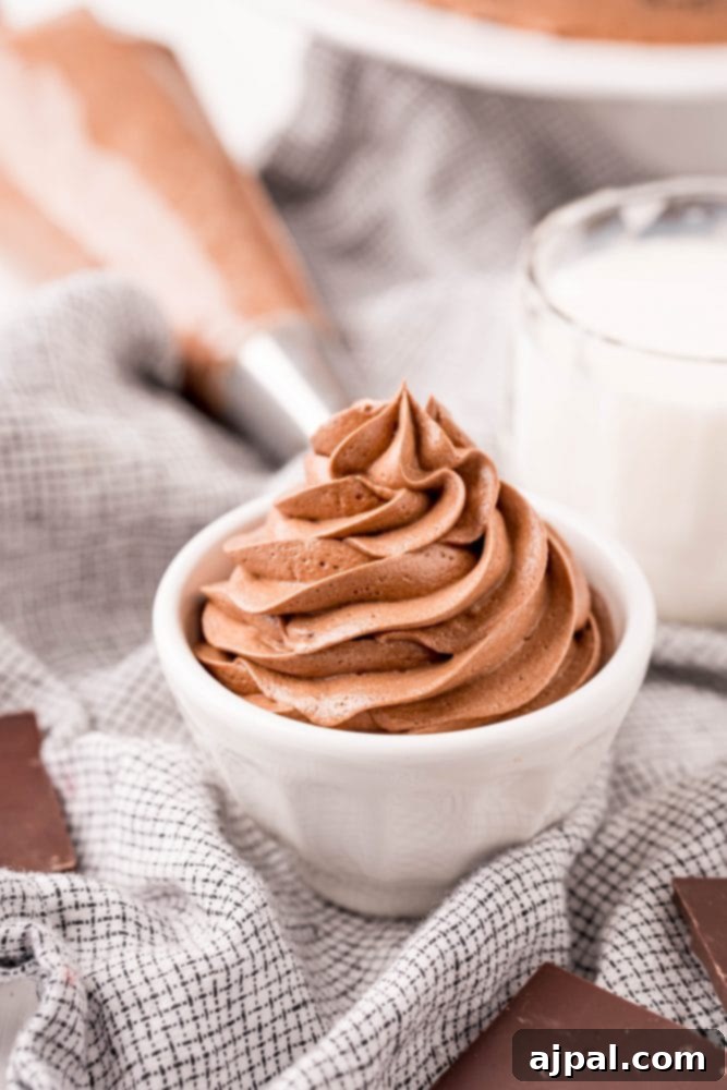 Appetizing bowl of chocolate pudding frosting, garnished with whipped cream for a mousse-like dessert