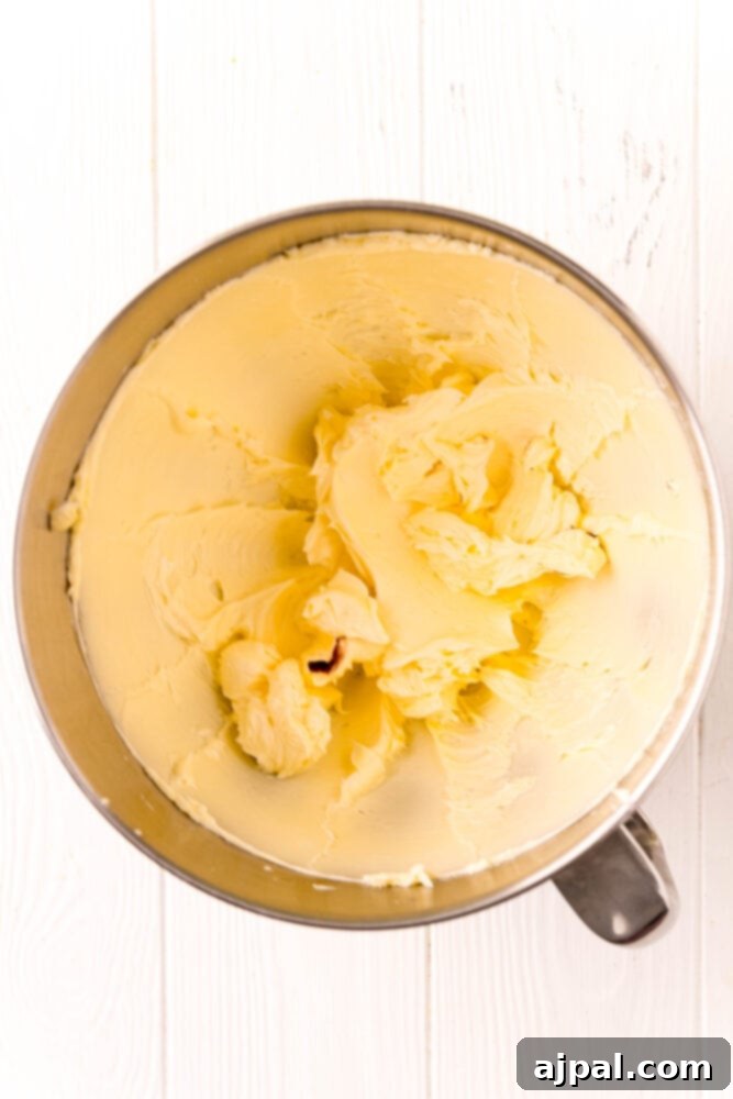 Creamed butter in a mixing bowl, light and fluffy