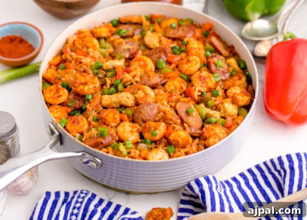 picture of jambalaya with shrimp, sausage, and chicken in a pan on a table