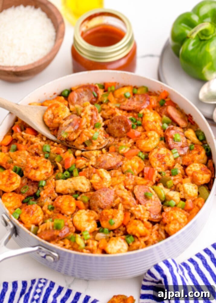 picture of jambalaya with shrimp, sausage, and chicken in a pan on a table