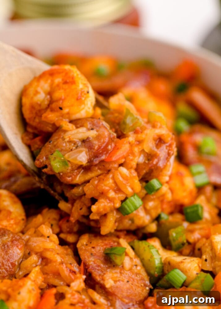 picture of jambalaya with shrimp, sausage, and chicken in a pan on a table