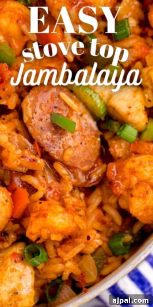 picture of jambalaya with shrimp, sausage, and chicken in a pan on a table