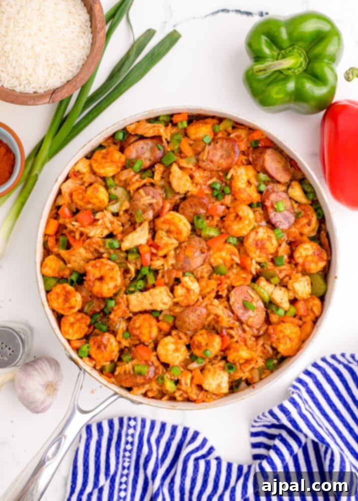 picture of jambalaya with shrimp, sausage, and chicken in a pan on a table