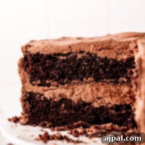 Decadent Chocolate Perfection 8 A homemade slice of black magic chocolate cake on a white plate.