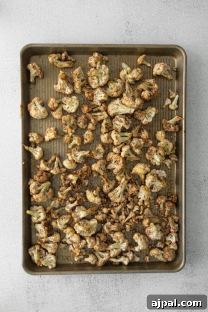 Your New Favorite Vegan Cauliflower Tacos 6 picture of cauliflower on a baking sheet