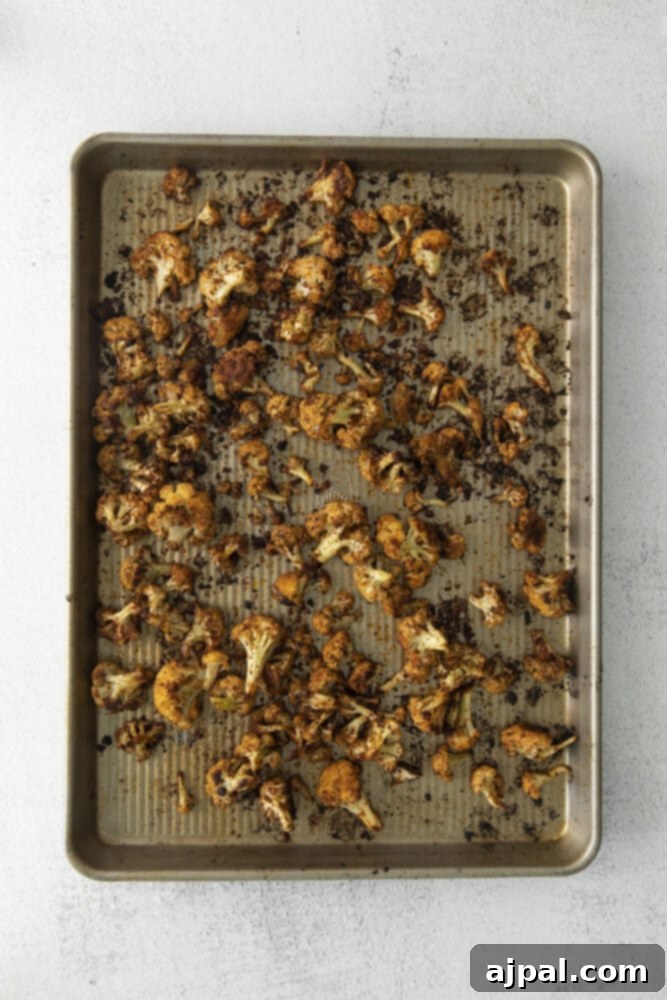 Your New Favorite Vegan Cauliflower Tacos 7 picture of roasted cauliflower on a baking sheet