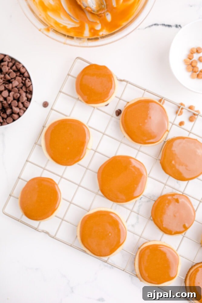 picture of shortbread cookies topped with caramel sauce, creating the middle layer of the Twix cookie.