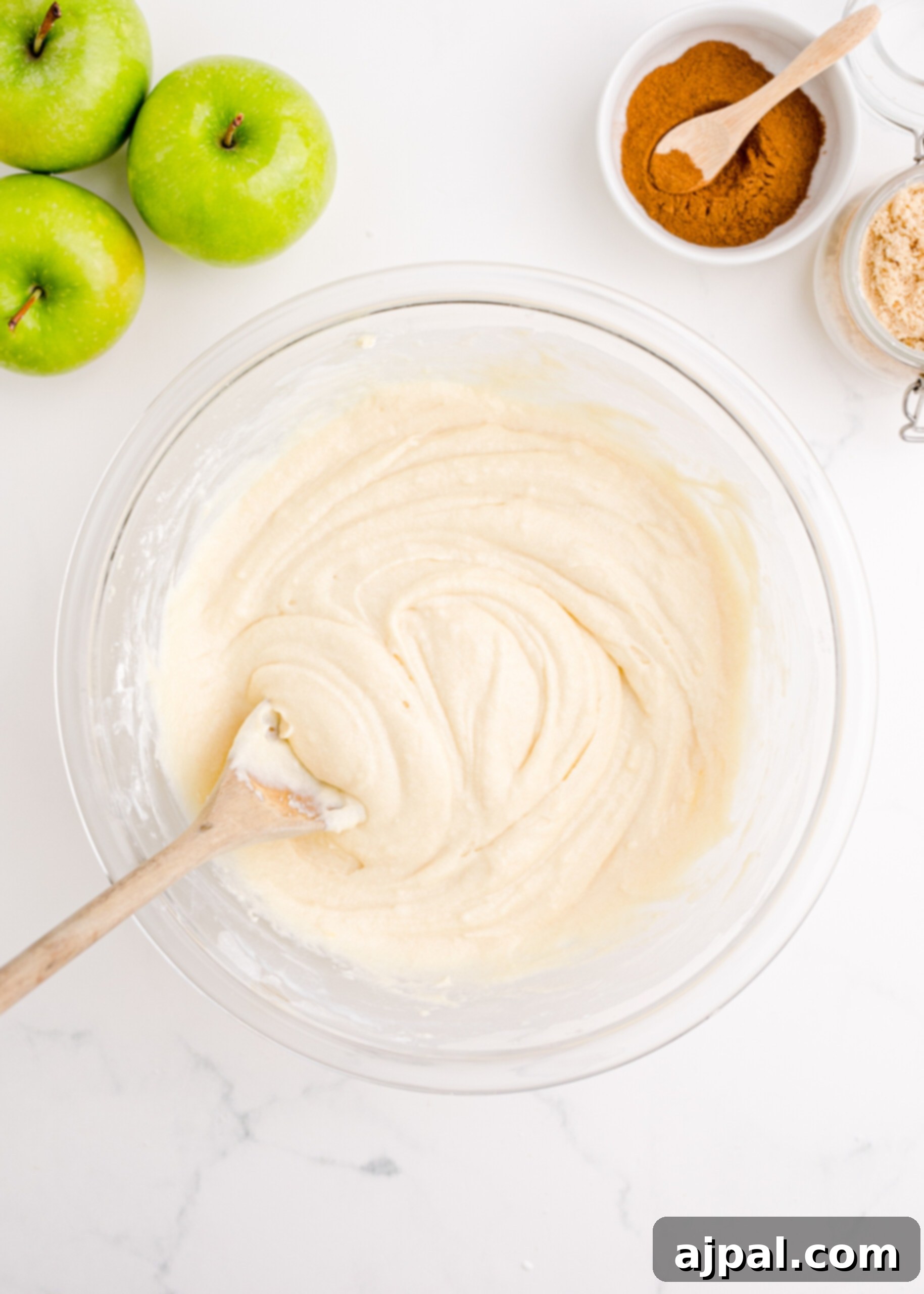 Close-up picture of mixed bread dough, showing a smooth and consistent batter texture.