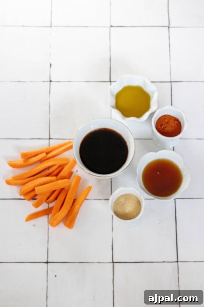 Ingredients for vegan carrot bacon, including fresh carrots, soy sauce, and spices, laid out on a table before mixing.