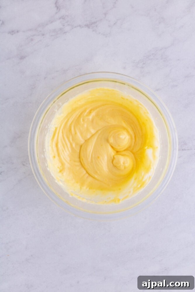 The smooth and creamy cheese danish filling in a bowl, ready to be spread onto the puff pastry.