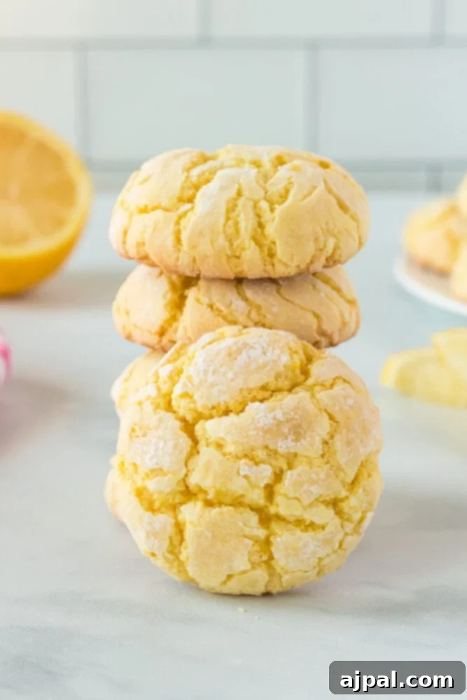 A stack of golden lemon cake mix cookies on a luxurious marble counter, evoking a sense of sweet indulgence and refined simplicity.