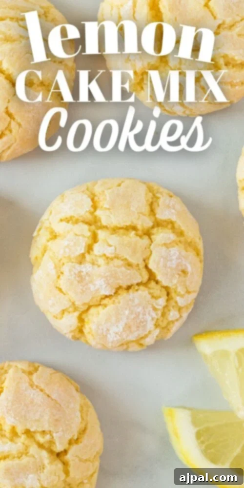 A vibrant close-up of finished lemon cake mix cookies arranged on a baking sheet, showcasing their soft, crinkled tops and inviting yellow hue.