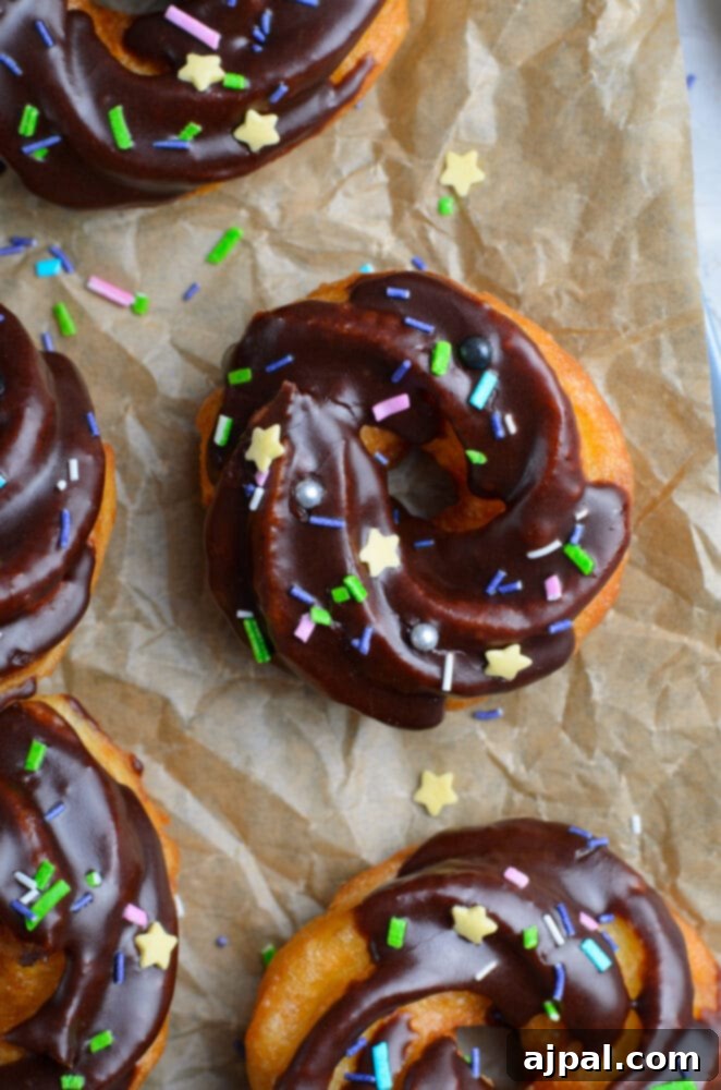 picture of cruller donut with chocolate glaze and sprinkles