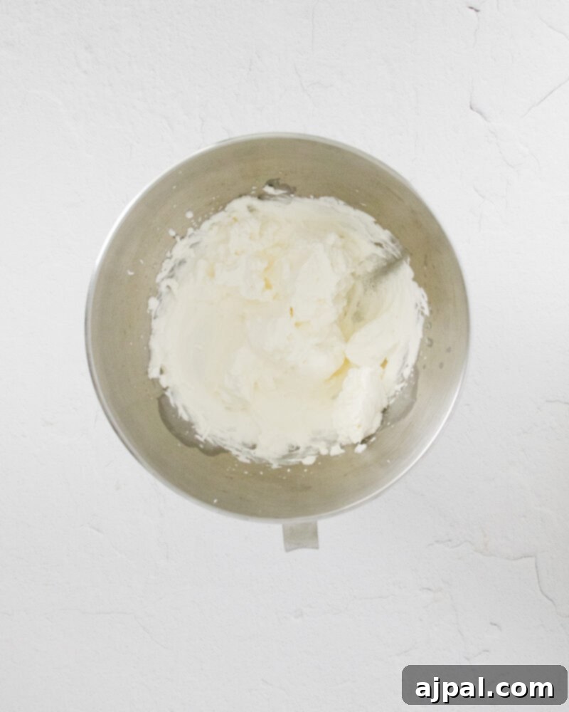 Easy No Bake Oreo Cheesecake 7 picture of cream cheese mixture in a bowl