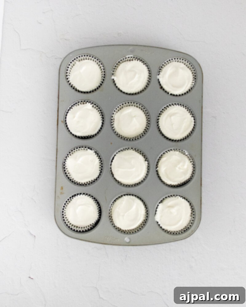 Easy No Bake Oreo Cheesecake 9 picture of mini oreo cheesecakes in a muffin tin