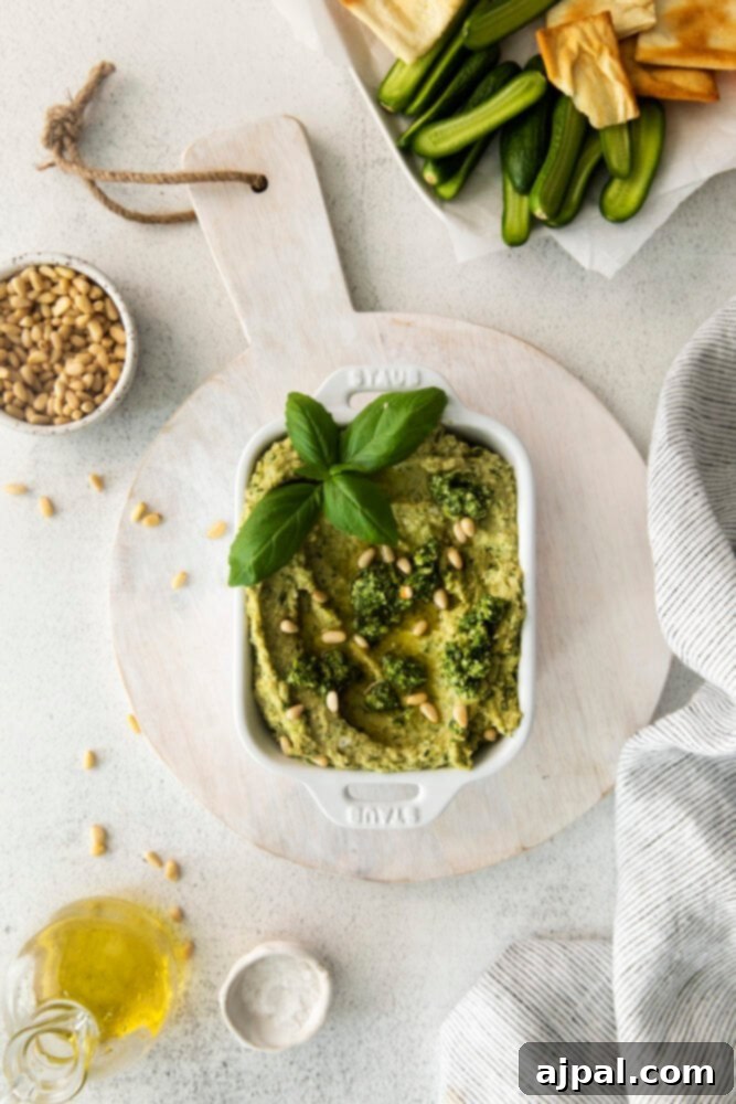 Vibrant Pesto Hummus 10 picture of pesto hummus in white bowl