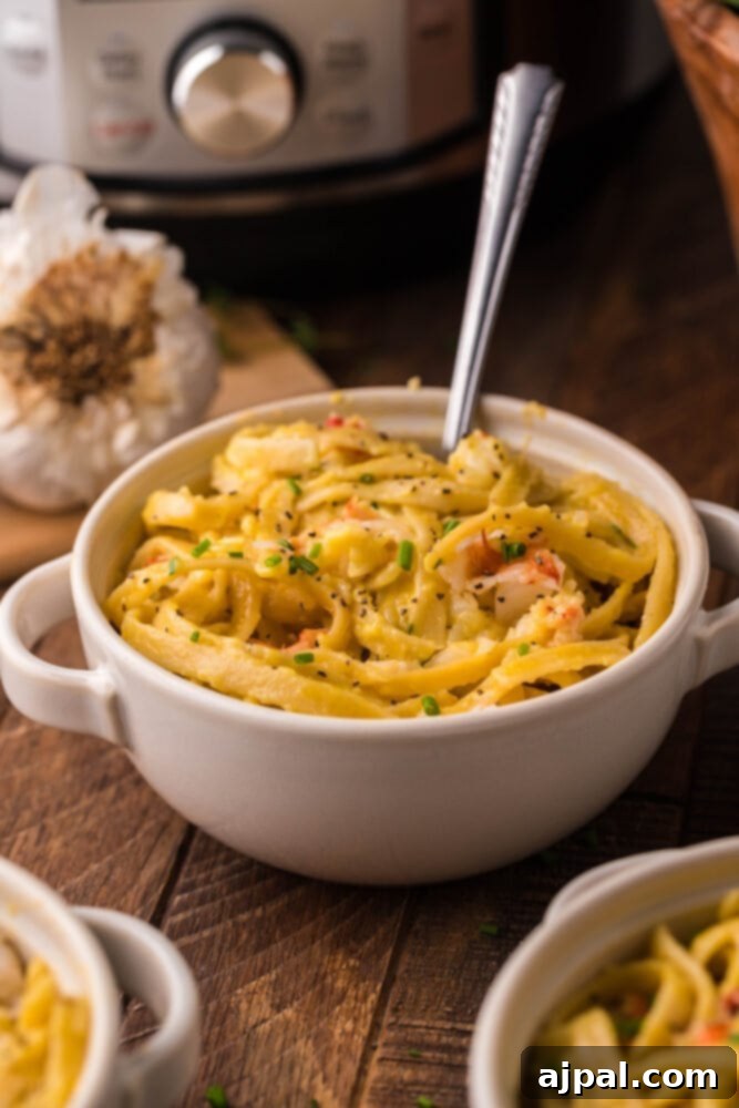 Instant Pot Creamy Lobster Brie Pasta 2 A beautifully presented bowl of creamy Instant Pot Lobster Brie Pasta, garnished with fresh herbs, ready to be enjoyed.