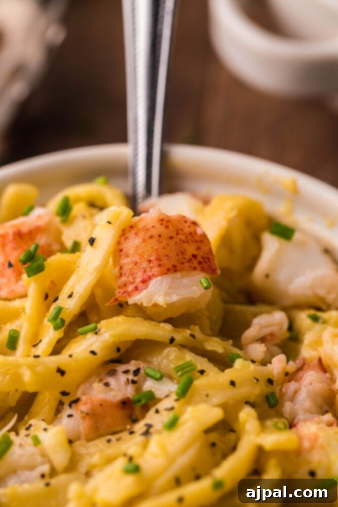 Instant Pot Creamy Lobster Brie Pasta 15 Another beautiful shot of Instant Pot Lobster Brie Pasta in a white bowl, highlighting its creamy texture and vibrant garnishes.