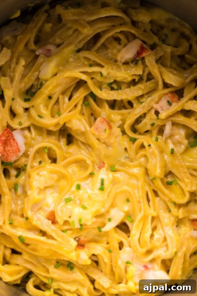 Instant Pot Creamy Lobster Brie Pasta 3 Close-up of lobster and brie pasta simmering perfectly in an Instant Pot, showcasing the rich, creamy sauce and tender pasta strands.