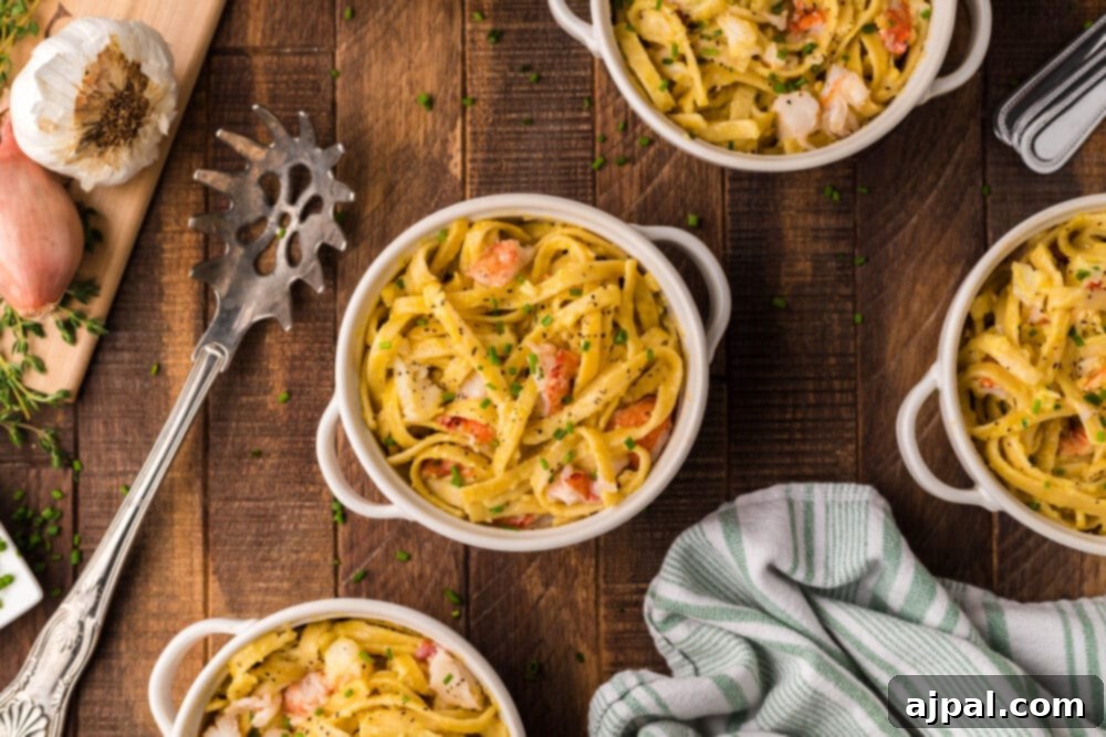 Instant Pot Creamy Lobster Brie Pasta 16 A vibrant display of four bowls of Instant Pot Lobster Brie Pasta, garnished with garlic and fresh herbs, arranged on a rustic wooden table.
