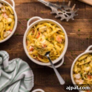 Instant Pot Creamy Lobster Brie Pasta 18 picture of lobster pasta in a white bowl