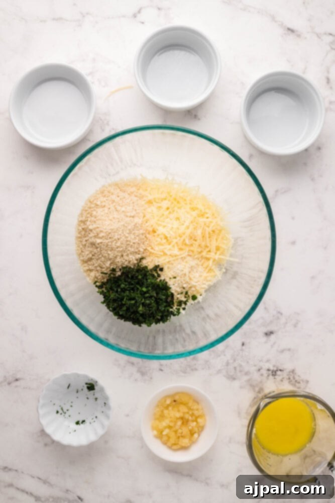 A bowl filled with freshly chopped parsley, ready to be incorporated into the Parmesan crust mixture.