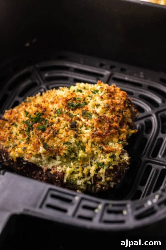 Air Fryer Longhorn Style Parmesan Crusted Steak 16 picture of steak with parmesan crust on top on a plate