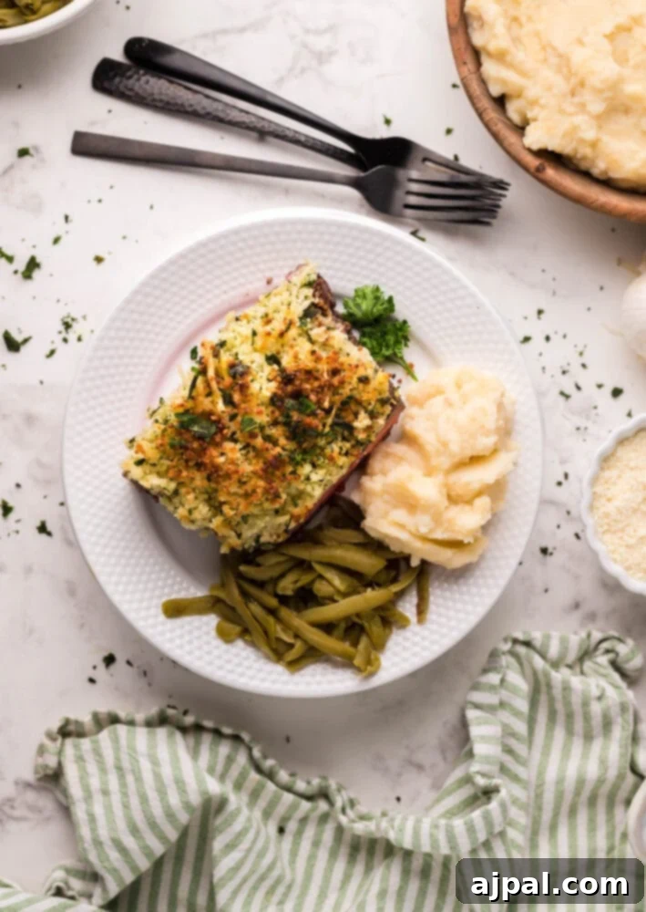 Air Fryer Longhorn Style Parmesan Crusted Steak 3 picture of steak with parmesan crust on top on a plate
