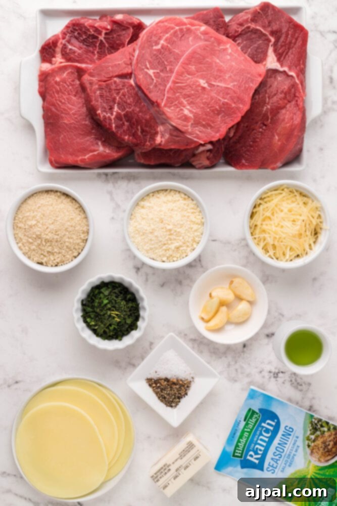 Assorted ingredients for the Parmesan crust, including fresh herbs, butter, and cheeses, arranged on a rustic wooden surface.