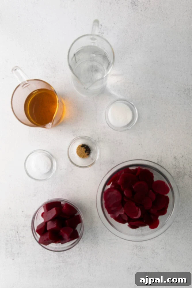 Ingredients for quick pickled beets: beets, sugar, salt, and apple cider vinegar on a table.