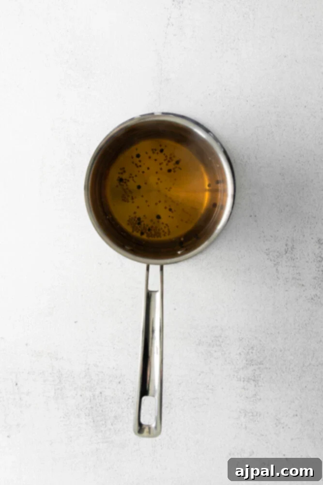 Boiling pickling liquid in a saucepan.